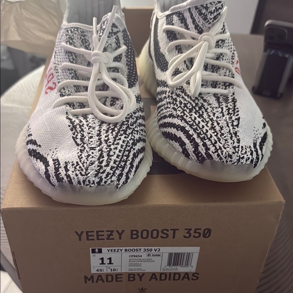 Adidas Black and White Sneakers with Boost Cushioning